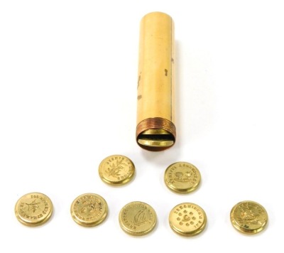 A 19thC French brass sealing wax etui, with mother of pearl screw on cover, and incorporating a stack of twenty four double sided seals and a sleeve retaining disc, 9cm high.