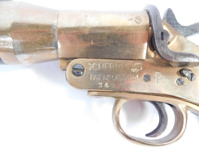 An early 20thC Schermuly's line throwing pistol, being an implement used for lifesaving of those in vessels in distress, patent number 563324, Serial No.12892, bears proof marks, with mahogany handle and iron barrel, 50cm wide. - 4