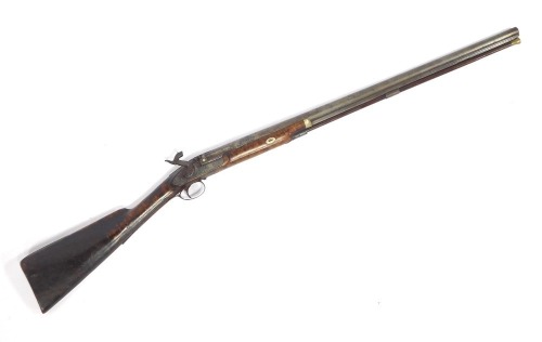 An early 19thC muzzle loading percussion shotgun, with figured walnut stock, ramrod and indistinct makers name XX-Bros, 107cm overall length.