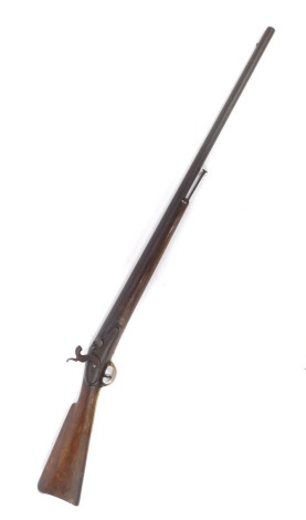 A 19thC muzzle loading shotgun, percussion conversion from flintlock, with mahogany stock and steel ramrod, 129cm overall length.