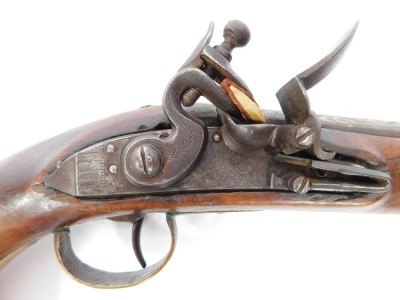 A 19thC flintlock pistol, with silvered mounts and engraved lock with ramrod, 47cm. - 2