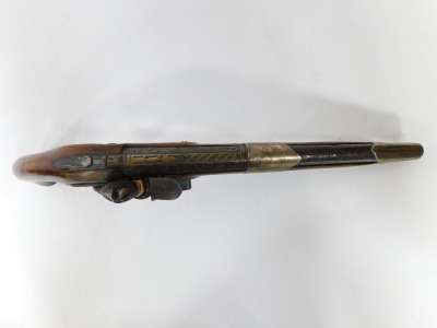 A 19thC flintlock pistol, with silvered mounts and engraved lock with ramrod, 47cm. - 5