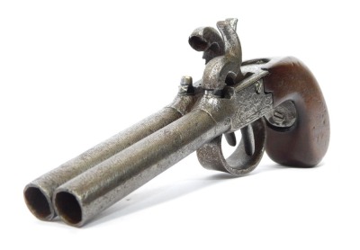 An early 19thC double barrel percussion pocket pistol, walnut handle, 20cm.