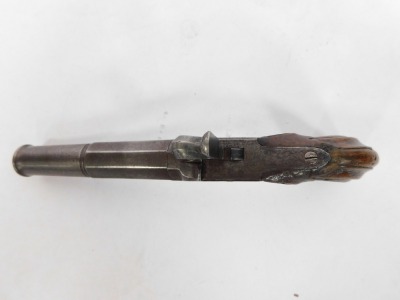 An early 19thC box lock percussion pocket pistol with detachable part turned and octagonal twist barrel, engraved lock, concealed trigger and carved walnut handle, 23cm. - 6