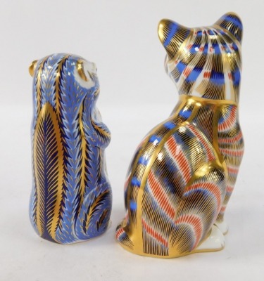 Two Royal Crown Derby paperweights, comprising cat, 12cm high, and otter, 10cm high, each with gold stopper. (2) - 2