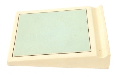 A Royal Doulton F Marden & Co Art Deco writing pad, on cream ground, with turquoise rectangular set panel, 12cm x 7.5cm.