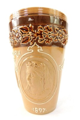 A Doulton Lambeth ware coronation beaker, in brown stoneware, for Queen Victoria, dated 1837 and 1897, 12.5cm high. (AF)