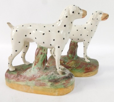 A pair of Staffordshire style Dalmatians, each on a mottled base, unmarked, 15cm high. - 2