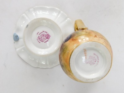 A Royal Worcester porcelain cream jug and dish painted with fruit, the milk jug by E Townsend, marked M9535, 7cm high, the saucer by A Shuck, 9 ½cm diameter. (2) - 2