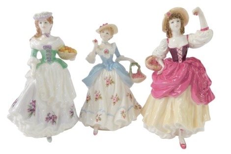 Three Coalport Ladies, comprising Ripe Cherries Ripe, Strawberries Scarlett Strawberries, and Oranges & Lemons, each 23cm high. (3)