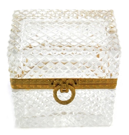 A pressed glass jewellery casket, with rectangular top, and gilt banding, 10cm high, 10cm wide, 7cm deep.