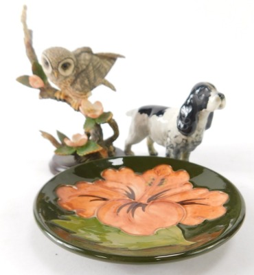 Three named ceramics, comprising a Moorcroft Peony pin dish, 12cm diameter, a Beswick Spaniel, and a Country Artists Barn Owl on branch. (3) - 2
