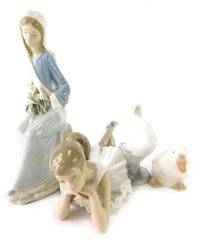 Lladro and Nao porcelain figures, comprising a Lladro figure of a lady with daffodils, 24cm high, a Lladro geese, 12cm high, Nao goose, 8cm high, and a Nao seated ballerina, 21cm diameter. (4)