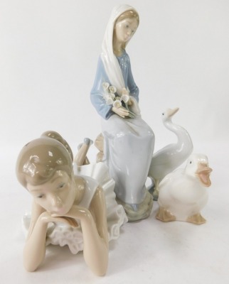 Lladro and Nao porcelain figures, comprising a Lladro figure of a lady with daffodils, 24cm high, a Lladro geese, 12cm high, Nao goose, 8cm high, and a Nao seated ballerina, 21cm diameter. (4) - 2