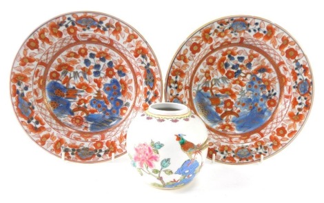 A pair of 19thC Chinese Imari soup plates, 23cm diameter, and a Chinese ginger jar, 10cm high. (3)