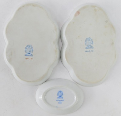 Three Herend of Hungary trinket dishes, comprising two flared rim examples, each with floral decoration, 14cm diameter, and an oval pin dish with blue bell design, 8cm diameter. Marked K2000, 7705FD & 7705BT. (3) - 3