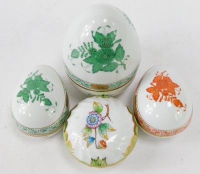 Four Herend of Hungary porcelain trinket dishes, two formed as eggs, in green painted Apponyi or Chinese bouquet pattern, the other orange, a large domed top egg, and a floral butterfly design trinket dish. (4) - 2