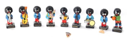 Nine Robertsons advertising figures, each painted, together with a pin badge (AF). (10)