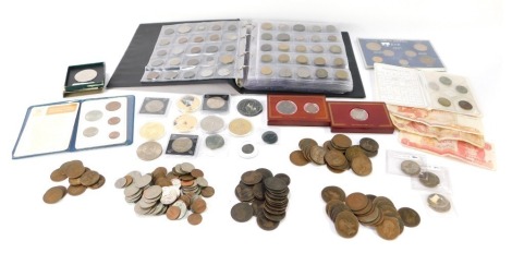 A group of coins, comprising Penny Farthings, King's Shillings, George V Shillings/Florins, Victorian Pennies, Festival of Britain commemorative coins, coin packs, album containing mixed UK and World stamps, commemorative crowns, etc. (a quantity)