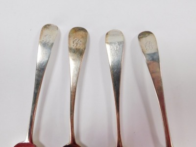 Four Georgian/William IV silver fiddle pattern serving spoons, each bearing the initial B, comprising two London 1823 and two 1831, 7 ¾oz. (4) - 2
