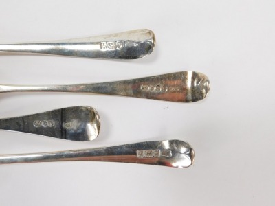 Four Georgian/William IV silver fiddle pattern serving spoons, each bearing the initial B, comprising two London 1823 and two 1831, 7 ¾oz. (4) - 3