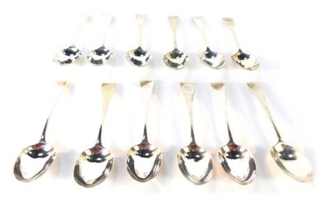 A set of twelve Victorian silver fiddle pattern table spoons, each bearing initial B, London 1864, 15 ¾oz.