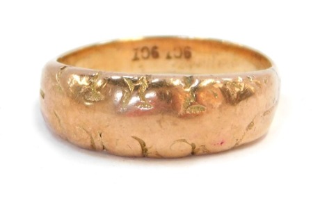 A 9ct gold dress ring, the scroll design rose gold panel, stamped 9ct, 5.4g.