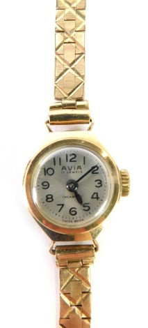 A 9ct gold Avia lady's wristwatch, with circular silvered coloured watch head, 1.5cm diameter, on a cross hatch design bracelet, 14.5g all in.