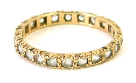 A 9ct gold eternity ring, set with round brilliant cut white stones, size Q, 1.9g all in.