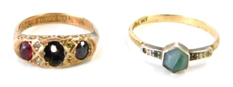 Two dress rings, comprising a 9ct gold and garnet set gypsy ring (one stone missing), size K, and a 9ct gold Art Deco style dress ring, with single blue stone and paste stones, size P, misshapen, 3.7g all in. (2)