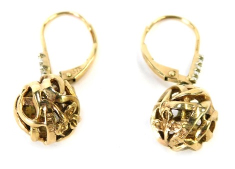 A pair of ball drop earrings, the interwoven ball design set with 3 point flower set with CZ set loop, with clip in back, yellow metal marked 375, 3cm drop, 4.1g all in.