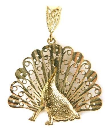 A peacock filigree pendant, the pendant with peacock and filigree leaves on a loop pendant clasp, yellow metal with import marks 375, 2.5g all in.