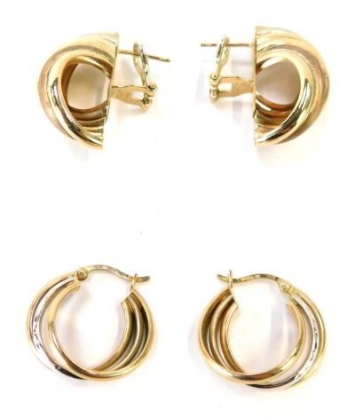 Two pairs of 9ct gold hoop earrings, to include a pair of bi-colour twist detail earrings, with brushed copper and silver effect detailing, and gold loop, 3cm high, together with another pair of 9ct gold three row hoop earrings, with central white gold pa