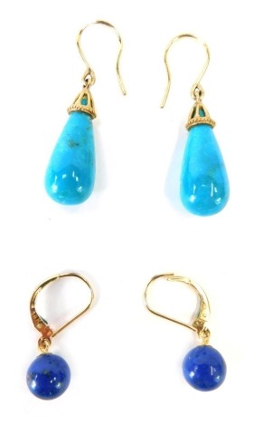 Two pairs of drop earrings, to include a pair of blue turquoise teardrop cut earrings with 9ct gold mounts, 3cm high and a pair of lapis bead drop earrings in 9ct gold mounts, 2.5cm high, 7.1g all in.