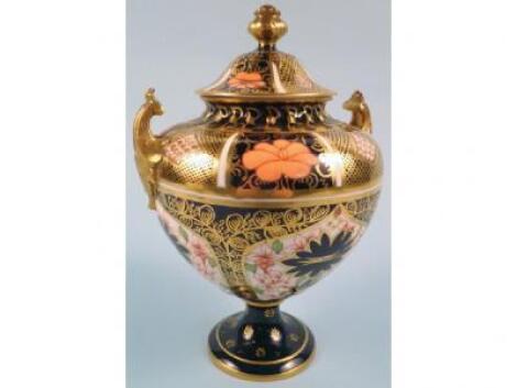 A Royal Crown Derby porcelain two-handled urn and cover