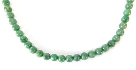 A jade necklace, with spherical light green jade beads, 4mm wide, on a 9ct gold chain and clasp, 45cm long, 40.5g all in.