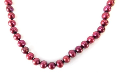 A cultured pearl necklace, with red lustre finish on string strand with 9ct gold marquis shaped clasp, 46cm long, 28.8g all in.