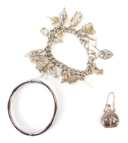 A group of silver jewellery, to include a Honora silver hinged bangle, 8cm diameter, a silver heart shaped pendant box, 3cm high and a silver charm bracelet with various charms, 49cm long, 117.2g all in.