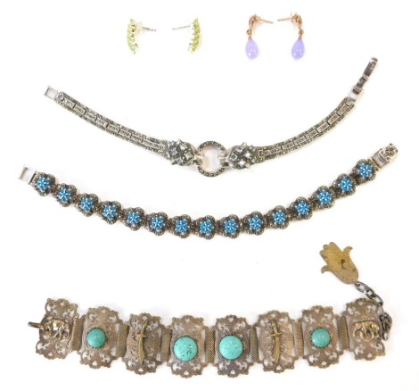 A group of silver stone set jewellery, to include a pair of silver and peridot set drop earrings, a loose Aurora single rose coloured earring, a silver marcasite set lion handled bracelet, a silver marcasite and blue stone bracelet and an eastern inspired