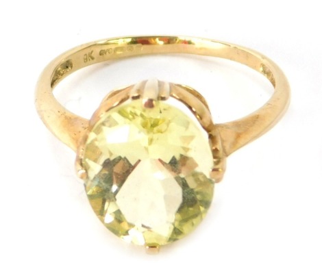 A 9ct gold dress ring, set with oval cut citrine in three splayed, four claw raised shank, ring size O, 2.6g.