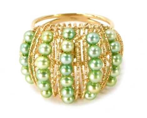 A 9ct gold half hoop dress ring, with raised and curved basket design, set with green lustre cultured pearls, and woven design stems, stamped Italy Milor, ring size Q, 5.2g all in.