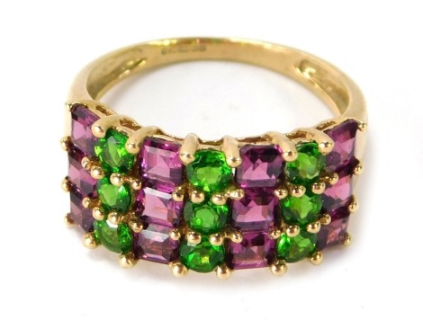 A 9ct gold half hoop eternity ring, set with a design of square cut pink topaz and peridot type stones, ring size P½, 3.2g all in.