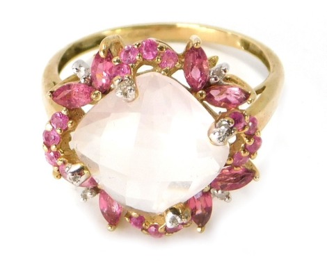 A 9ct gold dress ring, the central faceted moonstone surrounded by garnets, in a floral type cluster, ring size P½, 3.5g all in.