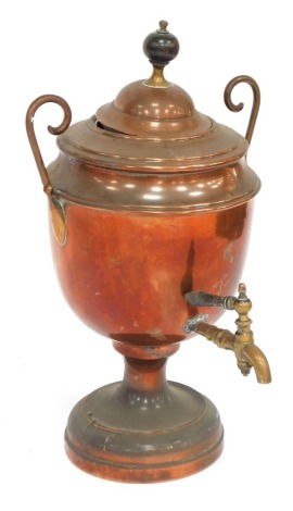 A late 19thC copper samovar, with lid and tap, on a circular foot, 45cm high.