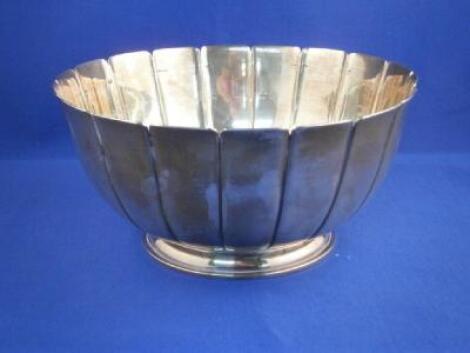 A silver bowl with a lobed edge