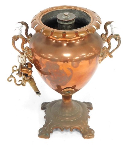 A 19thC copper samovar, with fluted top and brass handle, lid lacking, 38cm high. (AF)