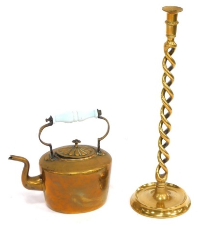 Two items of brassware, comprising a barley twist candle stick, 53cm high, and a kettle, 26cm high. (2)