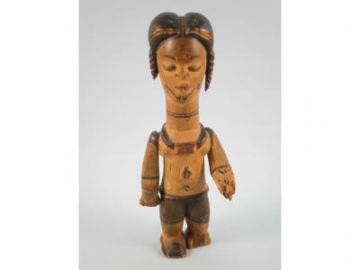 A carved African wooden female figure wearing a necklace and with articulated arms