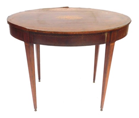 An Edwardian mahogany oval occasional table, with chequer banding, on square taper legs terminating on brass feet, 75cm high, 64cm wide, 94cm deep. (AF)