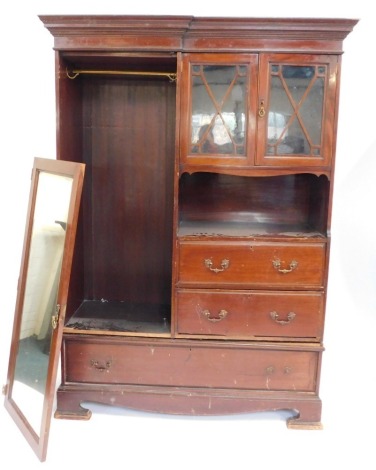 An Edwardian mahogany compactum wardrobe, with moulded cornice top, single mirrored door, two glazed panel doors, open shelf and three drawers, 206cm high, 137cm wide, 52cm deep.